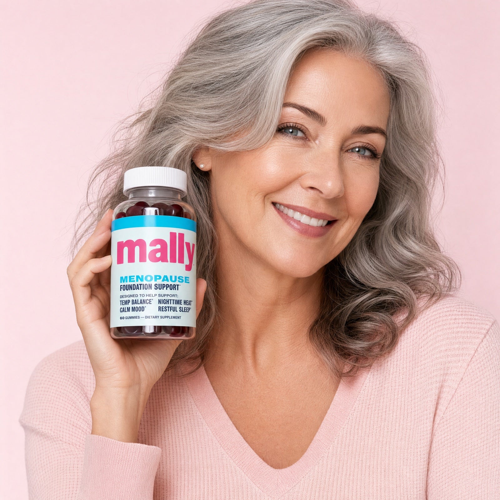 Woman holding Mally menopause gummies
